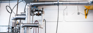 Photos of piping for an automated keg wash/fill line
